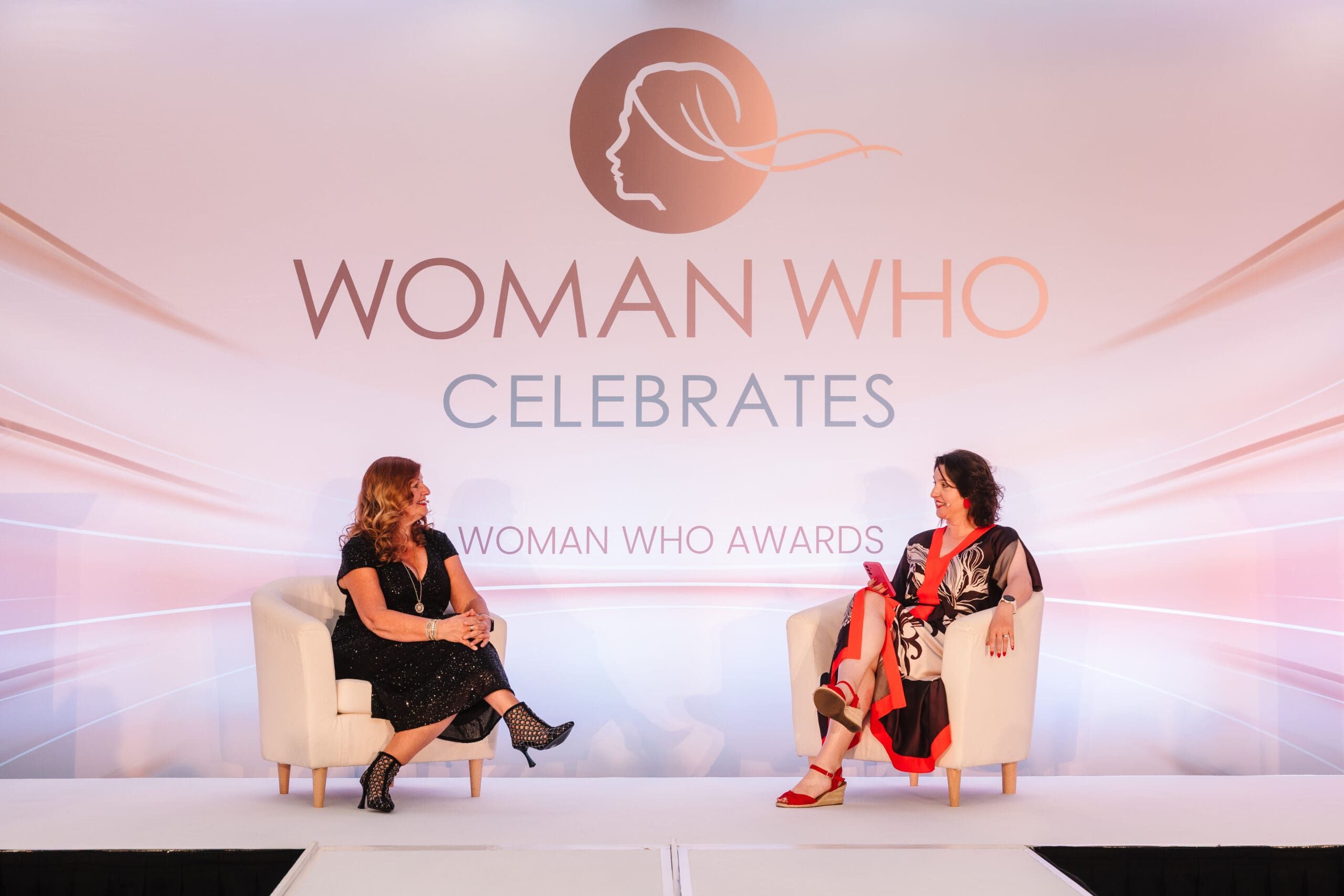 Sandra Garlick MBE being interviewed by Enfys Maloney on stage and the launch of the Woman Who Franchise
